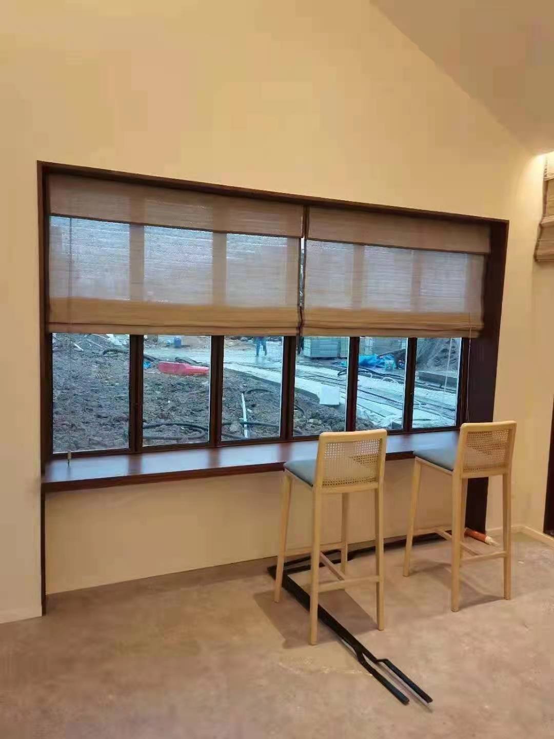 Installed roller blinds with cassette in a residential window setting