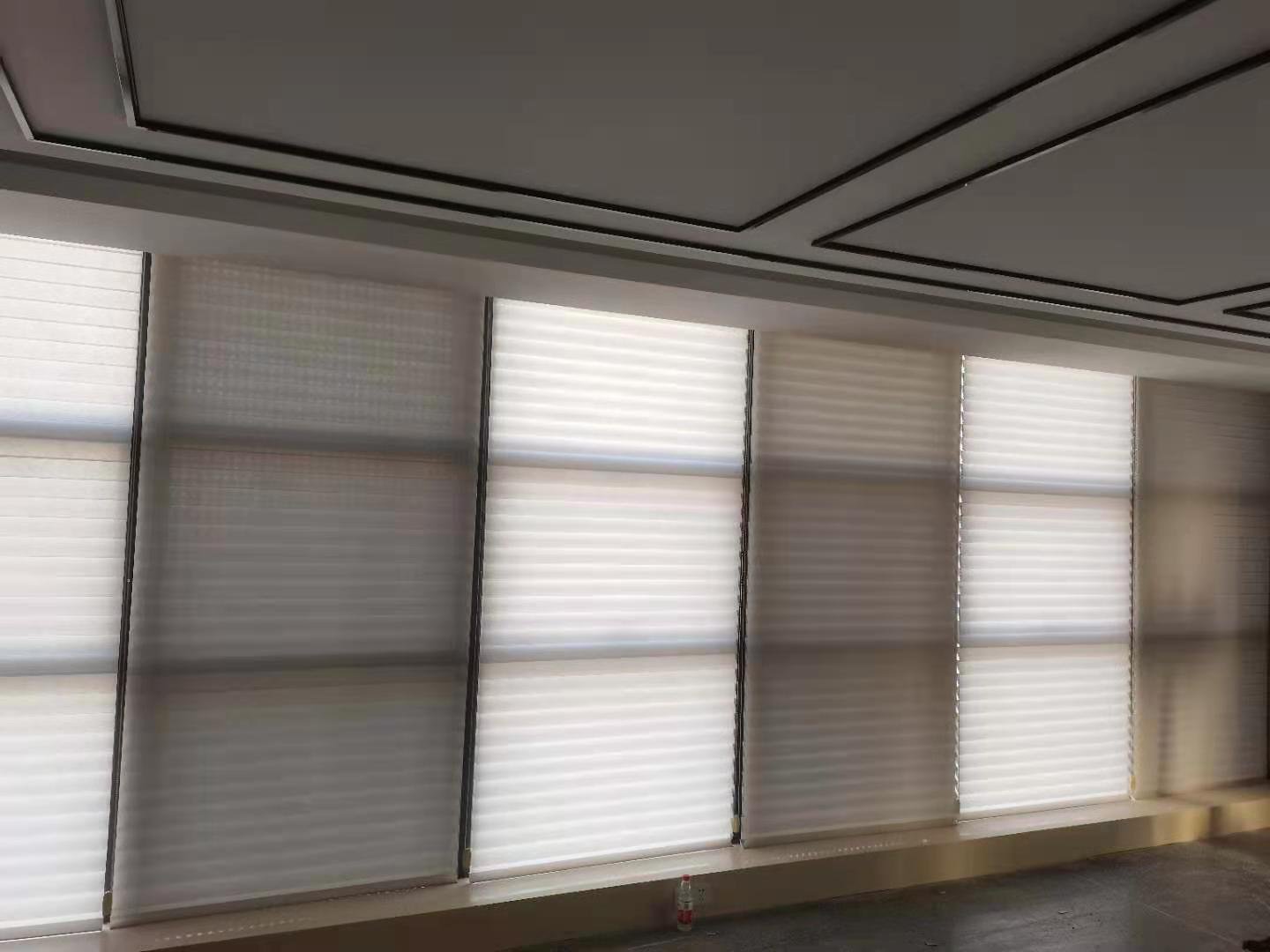 Zebra shades installed across a wide residential window project