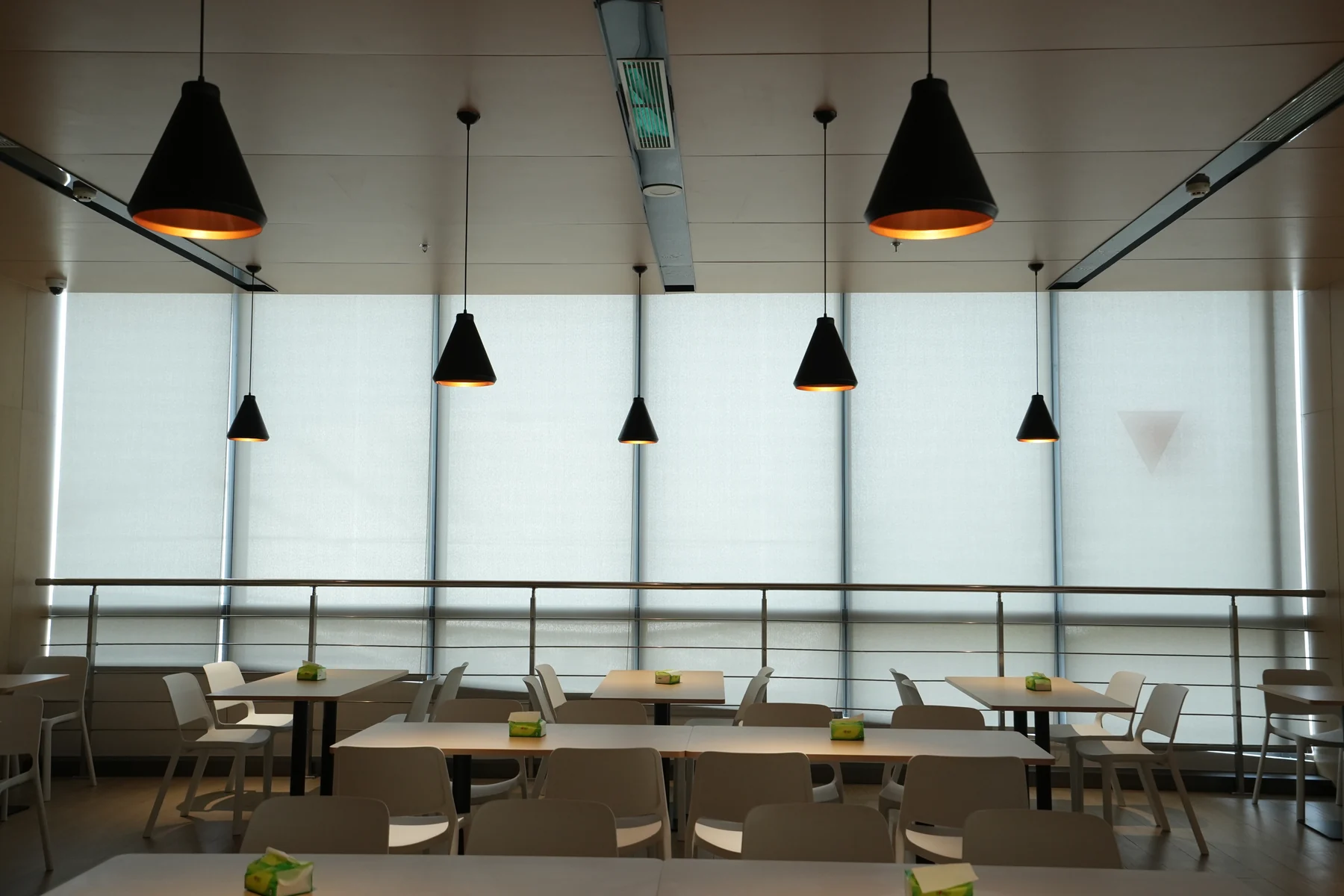 QinNong Bank Headquarters Shading Project QinNong Bank - Manual roller shades beside dining tables