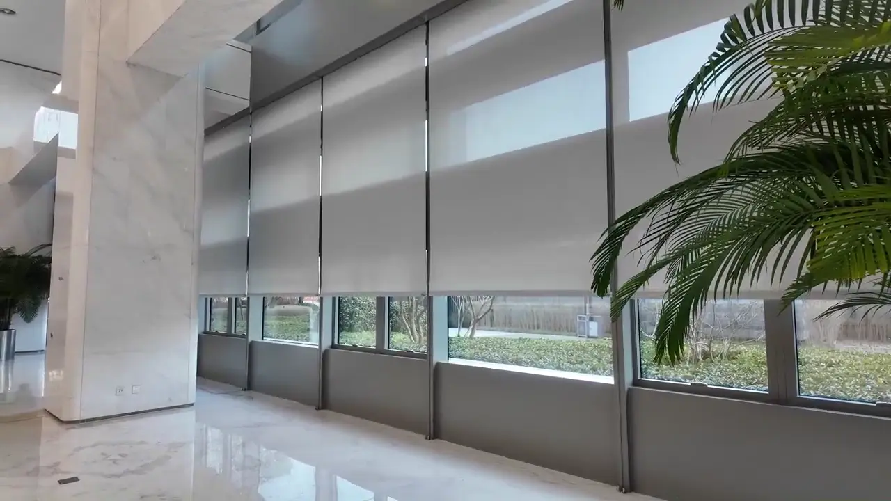 JD.com Headquarters Motorized Shading Project — Beijing Yizhuang Installed roller shades at different positions along a glazed public space.